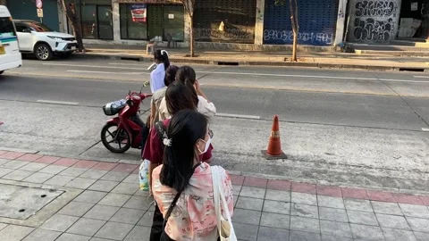 People stand in queue line on sidewalk waiting to ride public motorbike Video stock 265081542