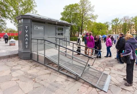 People stand in a queue near the public toilet in Samara, Russia Stock Photos