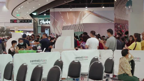 People Stand &amp; Wait In Line For Covid Flu Vaccination At Asia Indoor Clinic Stock-Footage 256057236