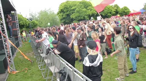 People standing and dancing in front of the musical stage Stock Footage 38047782