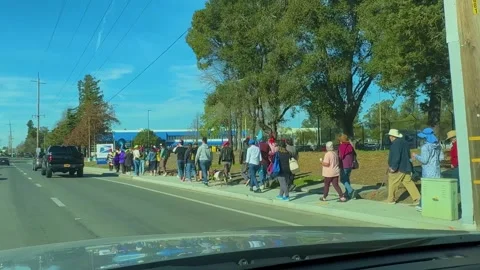 People Standing at a Busy Intersection Stock Footage 302924235