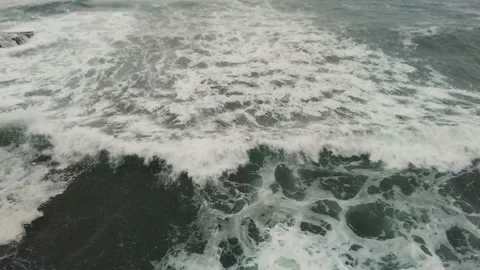 People Standing on Cliff with Ocean Waves Crashing Stock Footage 226402688