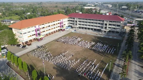 People standing on the field - drone goes farther up Stock Footage 192562111
