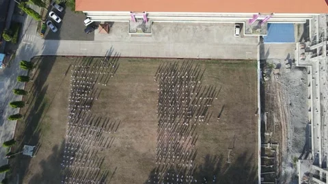 People standing on the field - drone shot (from far to near) Stock Footage 192558384