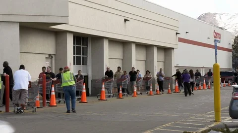 People standing in lines waiting to enter Costco due of Coronavirus. Stock Footage 126456935