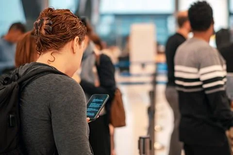 People standing with luggage in queue to check in in airport terminal. Tour.. Foto stock