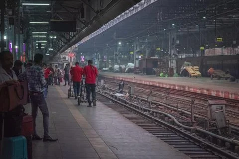 People standing on the platform waiting for the train at the Chhatrapati Sh.. Stock Photos