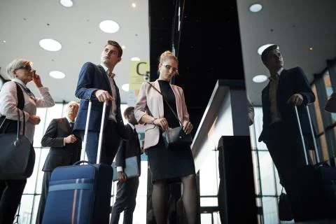 People standing in a queue at the airport Stock Photos