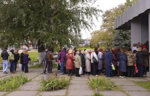 People standing in a queue to get to Dovzhenko movie studio. Kyiv, Ukraine Stock Photos