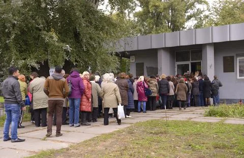 People standing in a queue to get to Dovzhenko movie studio. Kyiv, Ukraine Stock Photos