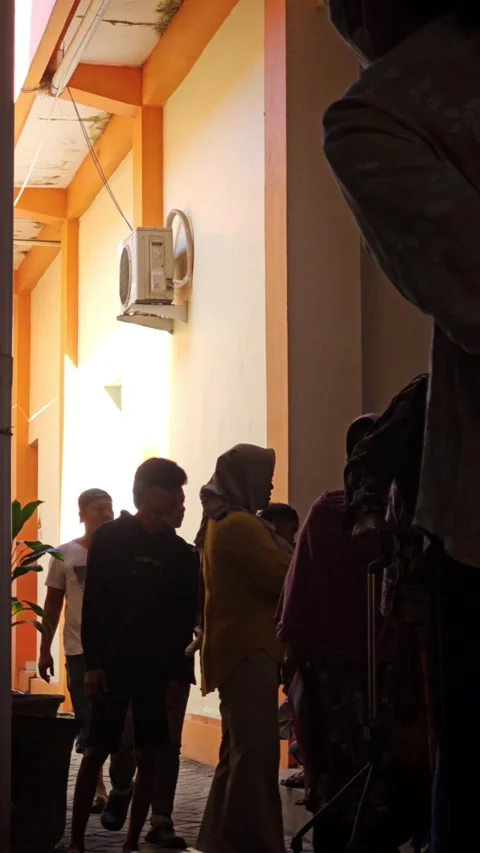 People Standing In Queue Outside Building Waiting Patiently Stock Footage 340028877