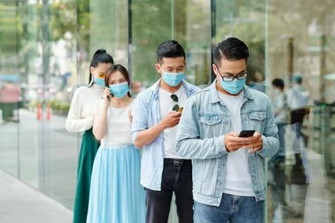 People standing in queue Stock Photos