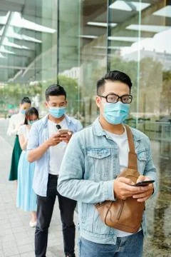 People standing in queue Stock Photos