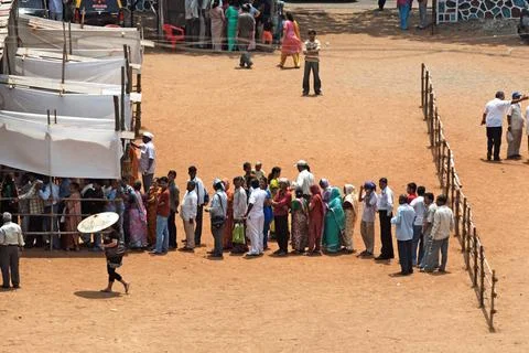 People standing in queue at polling station to casting vote in elections B... Stock Photos