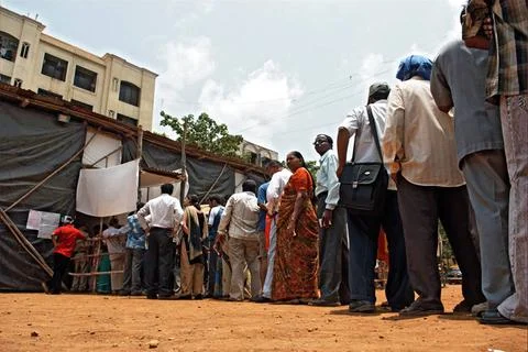 People standing in queue at polling station to casting vote in elections B... Stock Photos