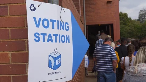 People standing in queue to vote for the 2019 South African elections with Stock Footage 107676807