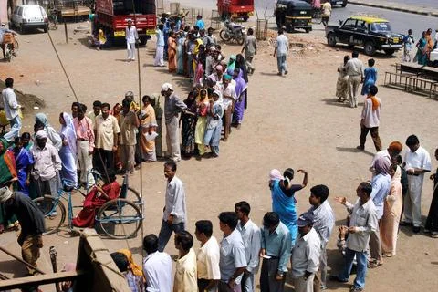People standing in a queue to vote during the 2004 Indian Loksabha electio... Stock Photos