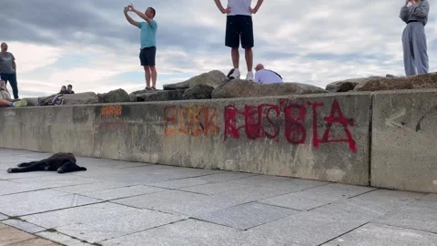 People standing on stone waterfront, low view Stock-Footage 346743193