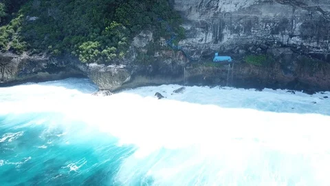 People Standing at Temple on Steep Cliffs by the Ocean [Drone Footage] Stock Footage 96287134
