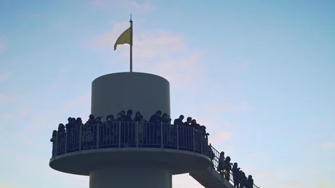 People standing on the tower waiting sunset. Stock Footage 101141965