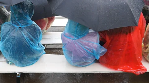 People in the stands in the rain Stock-Footage 63265164
