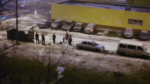 People stands at yard and launch firework in winter evening Vídeos de archivo 22734152