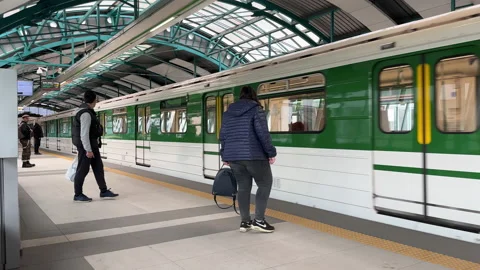 People on a station waiting for train to get in Video stock 239251389