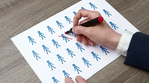 People statistics concept. Hand crossing out with marker population decrease.  Stockbeeldmateriaal 239671546