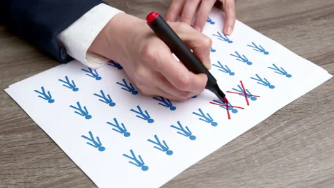 People statistics concept. Hand crossing out with marker population decrease.  库存影片 239671731