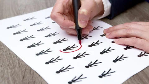 People statistics concept. The woman's hands mark the person  Stock Footage 248921560