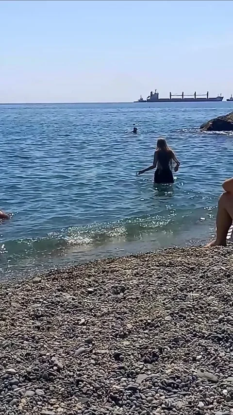 People on a stone beach Stock Footage 289229065