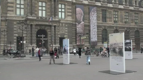 People street walking Paris France Louvre museum - day Stock Footage