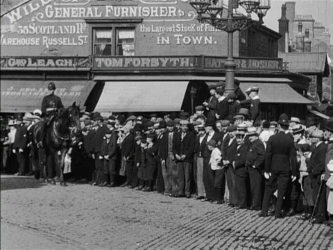 People at streets watching procession of firemen with horses, Nelson, UK 1902 Video stock 136682693