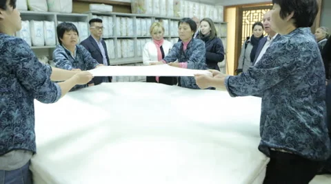 People stretched a special material on the table Stock Footage 44421804