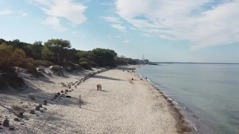 People stroll along the sandy Baltic beach Video stock 163205356