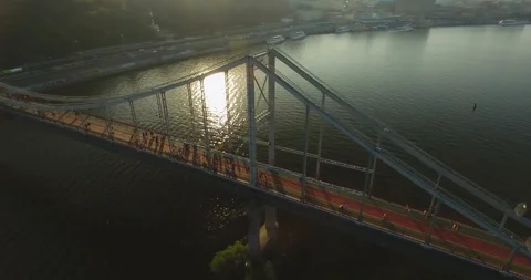 People Strolling On A Bridge Over River. Aerial View Stock Footage 95339924