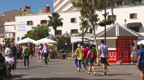 People strolling in Casemates Square, one of Gibraltar's tourist areas. Stock Footage 63933060
