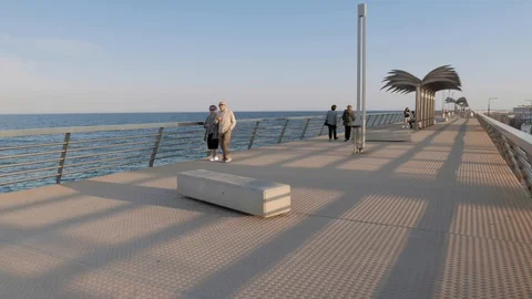 People strolling on the jetty of the dock Stock Footage 104670006