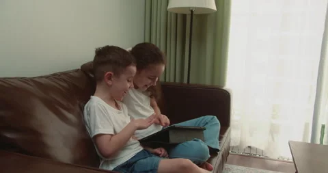 People Studying at School, learning at Home on the Tablet. Cute Kids Drawing on Stock Footage 238010797