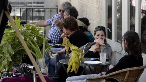 People in summer open cafe jerusalem Ein Karem israel Stock Footage 47967870