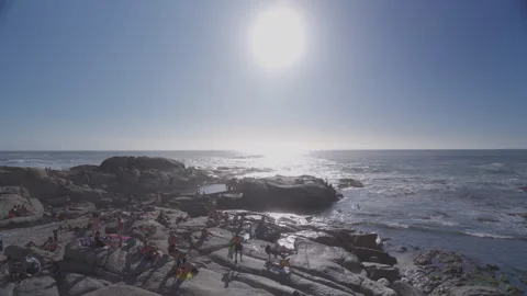 People Sunbathing at Saunders Rock Beach in Seapoint, Cape Town | Rec. 709 Stock Footage 308463572