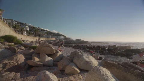 People Sunbathing at Saunders Rock Beach in Seapoint, Cape Town | Rec. 709 Video stock 308463987