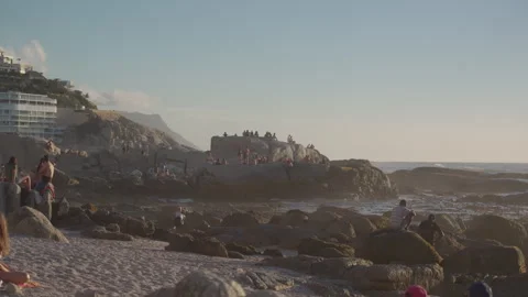 People Sunbathing at Saunders Rock Beach in Seapoint, Cape Town | Rec. 709 Stock Footage 308464101