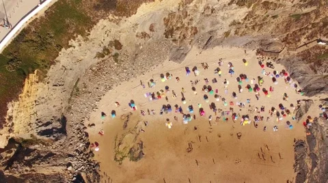 People sunbathing under umbrellas on the beach aerial view Stock Footage 66580183