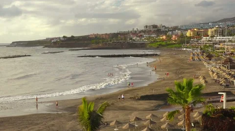People on sunset beach, Playa de las Americas, Tenerife, Canary islands. Stock-Footage 43349323
