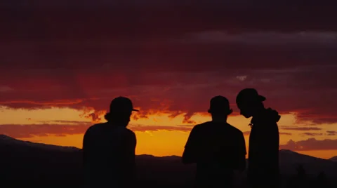 People at sunset on a mountain Stock-Footage 33649679