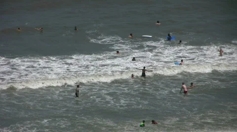 People in surf at beach Stock Footage 457452