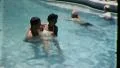 People Swim LOVING COUPLE in Swimming Pool 1960s Vintage Film Retro Home Movie HD Footage