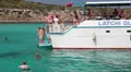 People swimming in the blue lagoon, jumping from the deck, Cyprus HD Footage