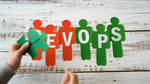 People symbols and puzzles with devops words. DevOps Concept for software eng Stock Footage 131358253